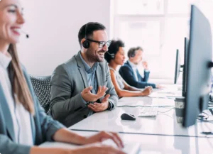 Office workers collaborating at desks